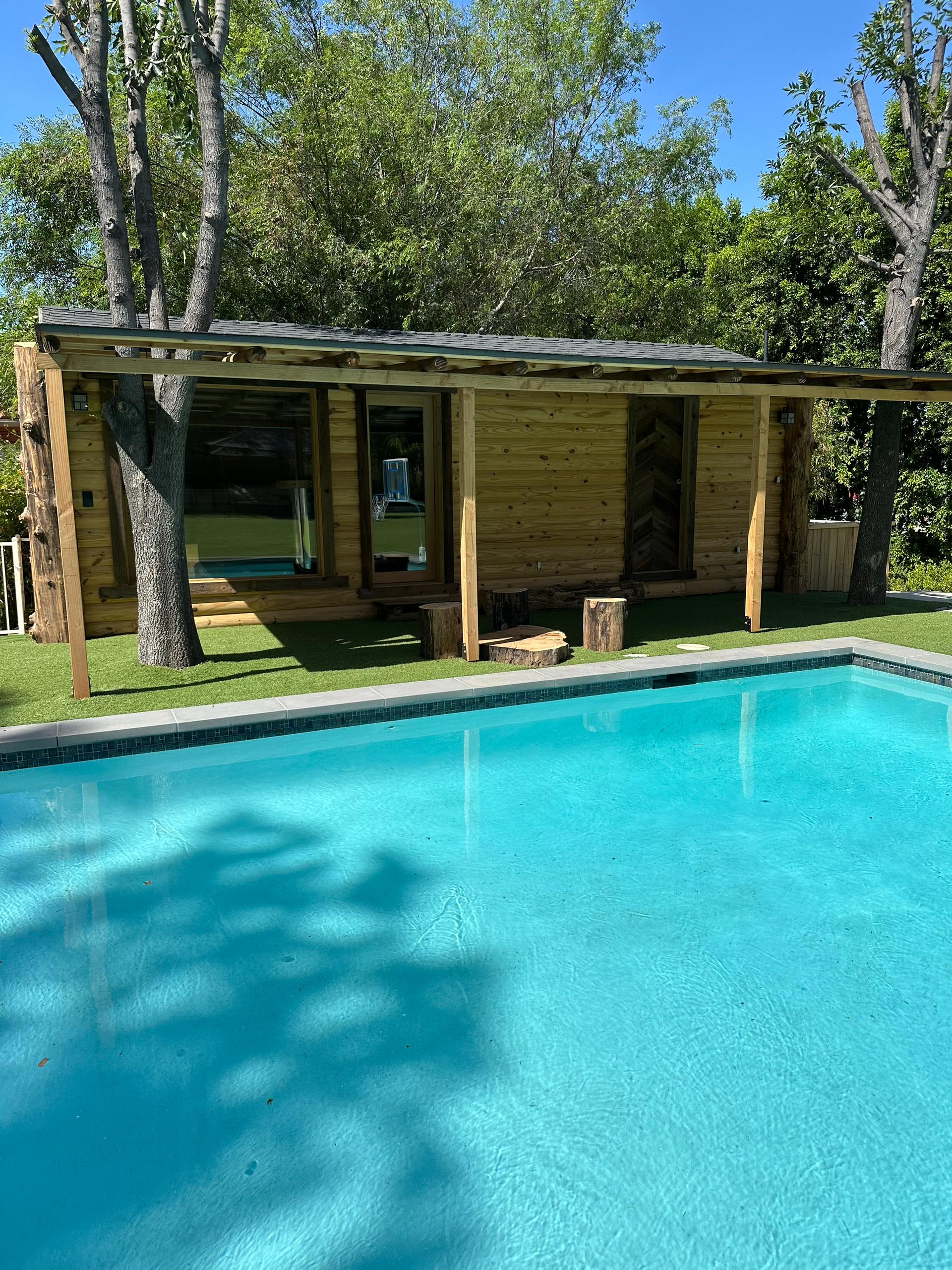 Outdoor pool and sauna spa area in Woodland Hills wellness retreat