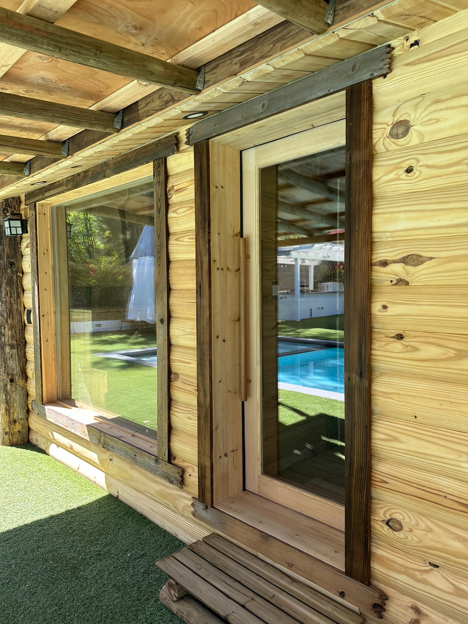 Wooden sauna exterior with large windows at wellness spa in Woodland Hills